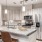 a kitchen with a marble island