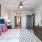 a bedroom with a bed and a mirror