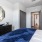 a bedroom with a mirror on the wall