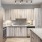 a kitchen with a cat on the counter
