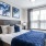 a bedroom with a bed and a fan